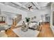 Inviting living room features hardwood floors, staircase, and modern decor at 11180 West Rd, Roswell, GA 30075