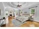 Spacious main bedroom boasts vaulted ceilings, a cozy fireplace, and expansive windows providing ample natural light and great views at 11180 West Rd, Roswell, GA 30075
