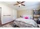Comfortable bedroom features wood floors, a soft bed, and natural light for a peaceful ambiance at 2545 Lake Royale Dr, Riverdale, GA 30296