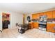 Functional kitchen with stainless steel appliances, tile flooring, and an eating table at 2545 Lake Royale Dr, Riverdale, GA 30296