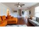 Inviting living room with hardwood floors, neutral walls, and stair access at 2545 Lake Royale Dr, Riverdale, GA 30296