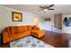 Cozy living room with hardwood floors, ceiling fan, and staircase access at 2545 Lake Royale Dr, Riverdale, GA 30296