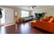 Bright living room with hardwood floors, ceiling fan, and cozy seating at 2545 Lake Royale Dr, Riverdale, GA 30296