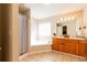 Large main bathroom with dual sinks, big mirror, soaking tub, and shower combo with tile floors at 2545 Lake Royale Dr, Riverdale, GA 30296