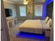 Modern bedroom with a padded headboard, LED lighting, and stylish furniture at 795 Hammond Dr # 813, Sandy Springs, GA 30328