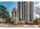 High-rise condo buildings surrounded by mature trees and amenity spaces at 795 Hammond Dr # 813, Sandy Springs, GA 30328
