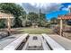 Outdoor lounge area featuring a fire pit and seating amid beautifully landscaped grounds at 795 Hammond Dr # 813, Sandy Springs, GA 30328