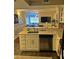 Kitchen with white cabinets, stainless steel dishwasher, and a breakfast bar overlooking the living room at 795 Hammond Dr # 813, Sandy Springs, GA 30328