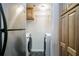 Laundry room featuring a washer, dryer, and storage shelves, offering convenience and organization at 795 Hammond Dr # 813, Sandy Springs, GA 30328
