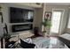 Modern living room featuring a wall-mounted TV, fireplace, and stylish furnishings at 795 Hammond Dr # 813, Sandy Springs, GA 30328