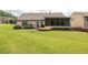 Well-maintained backyard with a patio and a screened-in porch, perfect for outdoor living at 1889 Raegan Way, Lawrenceville, GA 30043