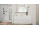 Bathroom featuring a shower, soaking tub, and neutral finishes at 1889 Raegan Way, Lawrenceville, GA 30043