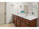 Bathroom featuring a double vanity, ample storage, and modern fixtures at 1889 Raegan Way, Lawrenceville, GA 30043
