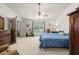 Large bedroom with two beds, exercise bike, neutral carpet, and large windows at 1889 Raegan Way, Lawrenceville, GA 30043