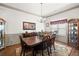 Elegant dining room with hardwood floors, chandelier, and space for a large table at 1889 Raegan Way, Lawrenceville, GA 30043