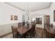 Dining room with neutral walls, wainscoting, and space for a large table at 1889 Raegan Way, Lawrenceville, GA 30043