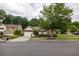 Charming single-story home featuring a two-car garage, well-manicured lawn, and inviting curb appeal at 1889 Raegan Way, Lawrenceville, GA 30043