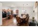 Bright kitchen featuring granite countertops, stainless steel appliances, and hardwood floors at 1889 Raegan Way, Lawrenceville, GA 30043