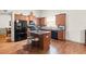 Bright kitchen offers granite counters, stainless appliances, and a functional center island at 1889 Raegan Way, Lawrenceville, GA 30043