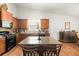 Well-lit kitchen with granite counters, stainless appliances and hardwood flooring at 1889 Raegan Way, Lawrenceville, GA 30043