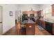 Well-lit kitchen with granite counters, central island and stainless steel appliances at 1889 Raegan Way, Lawrenceville, GA 30043