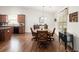 Open kitchen features granite countertops, stainless steel appliances, and hardwood floors at 1889 Raegan Way, Lawrenceville, GA 30043