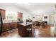 Open kitchen featuring granite countertops, stainless steel appliances, and hardwood floors at 1889 Raegan Way, Lawrenceville, GA 30043