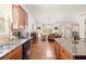 Open concept kitchen boasts granite countertops and a smooth flow to the dining area at 1889 Raegan Way, Lawrenceville, GA 30043