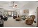 Spacious living room featuring high ceilings, a ceiling fan, and ample seating at 1889 Raegan Way, Lawrenceville, GA 30043