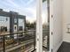 View from balcony showing other units in the building, with natural sunlight and greenery nearby at 415 Gartrell Se St # 16, Atlanta, GA 30312