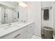 Modern bathroom with double sinks, a large mirror, and a glass-enclosed shower at 415 Gartrell Se St # 16, Atlanta, GA 30312