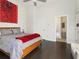 Bright bedroom with hardwood floors, a walk-in closet, and a full bathroom at 415 Gartrell Se St # 16, Atlanta, GA 30312