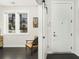 Cozy entryway features a modern door, seating, and natural light from the nearby window at 415 Gartrell Se St # 16, Atlanta, GA 30312