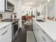 Open-concept kitchen offering modern appliances, sleek countertops, and a view of the living area at 415 Gartrell Se St # 16, Atlanta, GA 30312