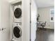 Convenient laundry closet with stacked washer and dryer, located near the bedroom and office at 415 Gartrell Se St # 16, Atlanta, GA 30312