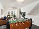 Comfortable living room with a foosball table, leather sofa, and bright natural light at 415 Gartrell Se St # 16, Atlanta, GA 30312