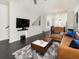 Open-concept living area with modern decor, TV, and comfortable seating at 415 Gartrell Se St # 16, Atlanta, GA 30312