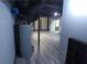 Unfinished basement with gray wood-look flooring and visible pipes and water heater at 5741 Wolf Laurel Ln, Lilburn, GA 30047