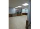 Finished basement with tile floor, paneling and a window with curtains at 5741 Wolf Laurel Ln, Lilburn, GA 30047