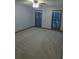 A bedroom has two windows, neutral carpet, and a ceiling fan at 5741 Wolf Laurel Ln, Lilburn, GA 30047