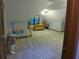 Bonus room with carpet flooring, a ceiling fan, and a built-in desk and shelving at 5741 Wolf Laurel Ln, Lilburn, GA 30047