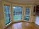 Cozy breakfast nook featuring three large windows providing natural light and backyard views at 5741 Wolf Laurel Ln, Lilburn, GA 30047