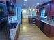 Kitchen featuring stainless appliances, granite countertops, tile backsplash, hardwood floors, and plenty of cabinets at 5741 Wolf Laurel Ln, Lilburn, GA 30047