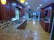Gourmet kitchen with granite countertops, hardwood floors, decorative backsplash, and ample cabinet space at 5741 Wolf Laurel Ln, Lilburn, GA 30047