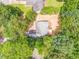 Birds-eye view of the house, surrounded by mature trees and greenery at 7074 Babbling Brook Dr, Jonesboro, GA 30236