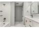 Bright bathroom featuring tub, shower, vanity, and modern fixtures at 7074 Babbling Brook Dr, Jonesboro, GA 30236