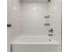 Bathroom featuring an alcove tub with marble-look tile surround and bronze hardware at 7074 Babbling Brook Dr, Jonesboro, GA 30236