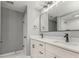 Modern bathroom with double vanity, elegant mirrors, and modern fixtures at 7074 Babbling Brook Dr, Jonesboro, GA 30236