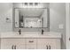 Modern bathroom with double sink vanity, quartz countertop, and large framed mirror at 7074 Babbling Brook Dr, Jonesboro, GA 30236