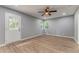 Bedroom featuring a ceiling fan, natural light from windows, and an exterior door at 7074 Babbling Brook Dr, Jonesboro, GA 30236